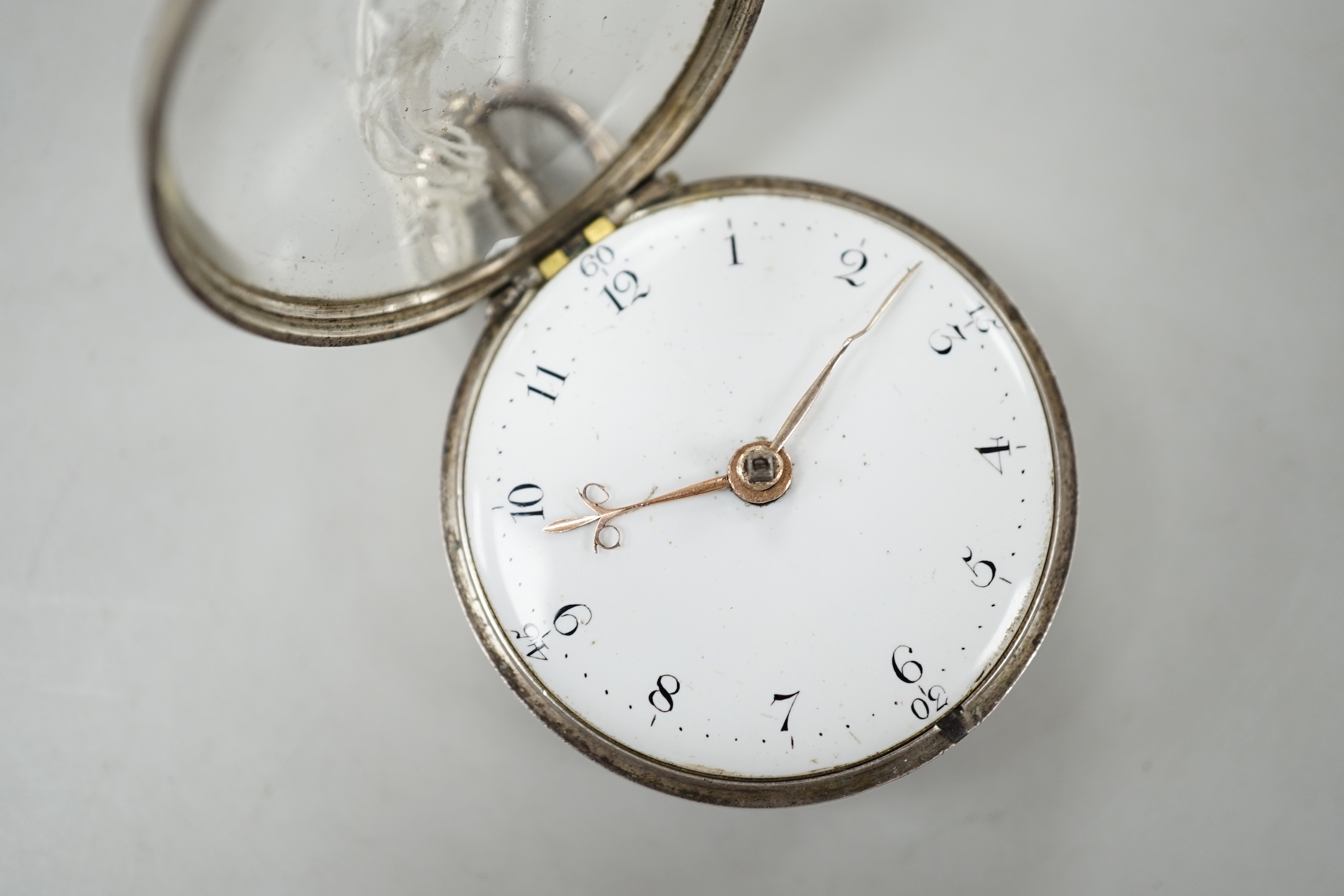 A George III silver pair cased verge pocket watch by Swanson of London, case diameter 50mm.